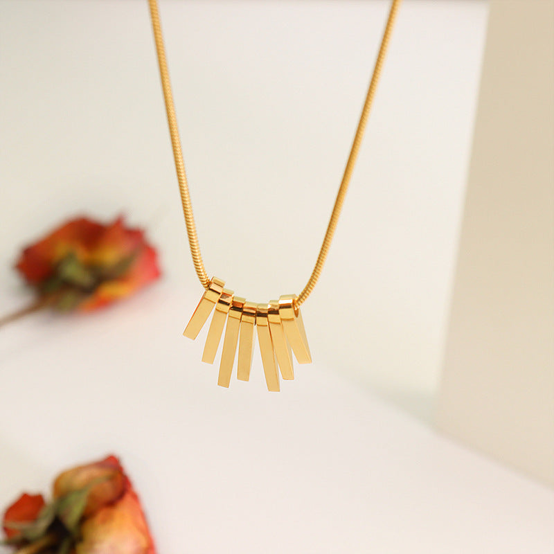 Collier en acier inoxydable avec motif touche de piano